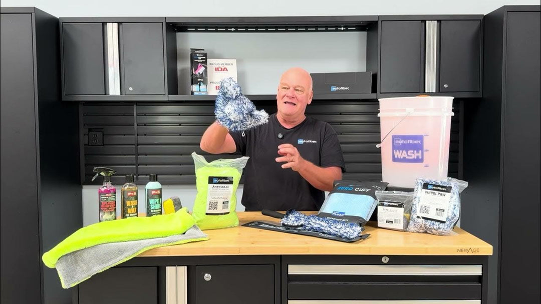 Picture of Prentice St. Clair holding an autofiber wheel paw demonstrating how to wash car wheels or rims