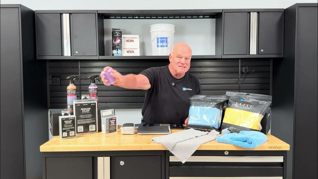 Prentice St Clair pictured holding clay putty for his video titled -How To Decontaminate Car Paint - Iron Removers, Clay Bars, Clay Towels & Prep Tips for DIY Detailing