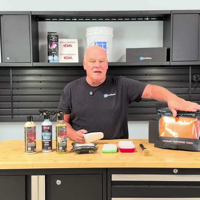 Picture of Prentice St Clair with his hand placed above an Autofiber drying towel for his video titled Interior Car Detailing Essentials - Tools & Products Every DIYer Needs